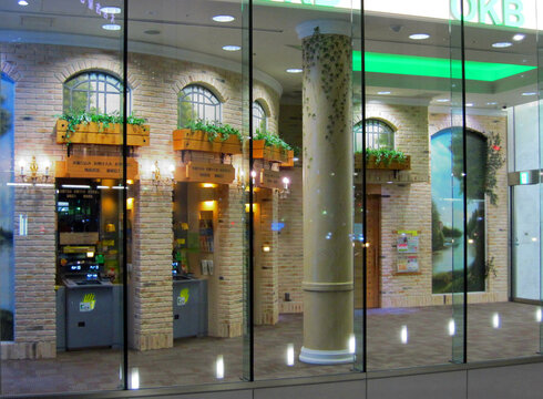 Nagoya, Japan - May 2016: Automatic teller machines installed at a beautiful vintage brick facade in OKB Harmony Plaza (Harmony Plaza)
