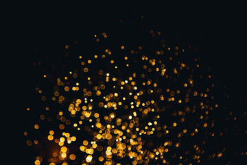 Abstract gold bokeh with black background