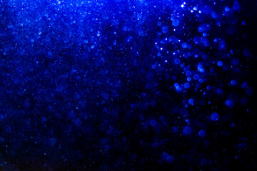 Blue glitter bokeh vintage lights with  black background