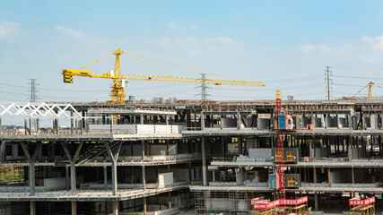 Construction site background. Crane and building under construction