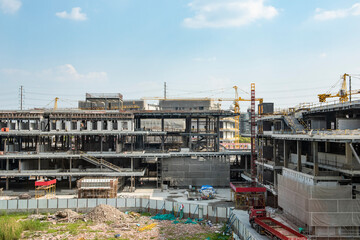 Construction site background. Crane and building under construction