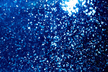 Blue glitter bokeh vintage lights with  black background