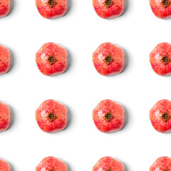 Seamless pattern with red pomegranate fruit on blue background. Minimal flat lay concept.