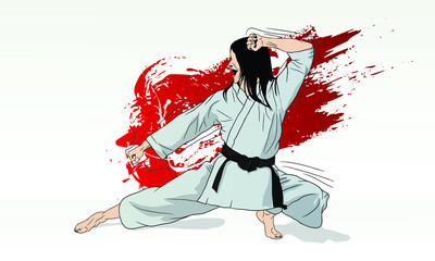 A karate girl stands in a combat position for striking.
