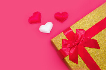 Happy Valentine's Day flatlay. Top view present gift box, hearts on on yellow color of the red background. panton