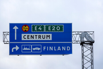 Road sign with directions of movement on a street in Stockholm, Sweden