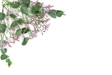 Flowers composition. Frame made of pink gypsophila flowers and eucalyptus branches on white background. Flat lay, top view, copy space