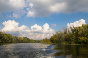 Autumn landscape on the river with trees on the bank