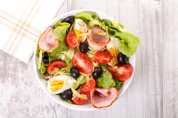 mixed vegetable salad with tomato, egg, ham