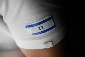 Patch of the national flag of the Israel on a white t-shirt