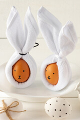 Easter Bunny ears made from napkins and eggs. Festive decoration for holiday