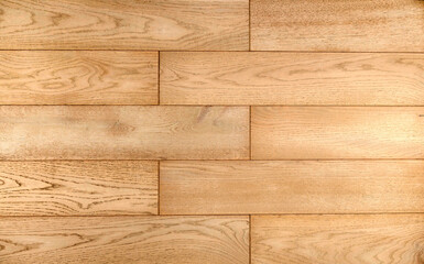 Light brown wooden parquet panels texture background