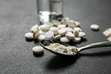 Spoon with drugs on dark background