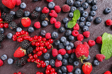 Different tasty berries on table