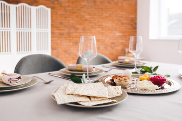 Passover Seder plate with traditional food on served table