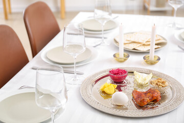 Passover Seder plate with traditional food on served table