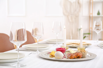 Passover Seder plate with traditional food on served table