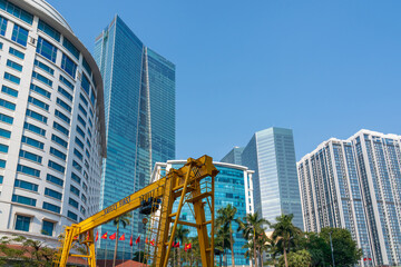 Obraz premium Hanoi city with construction crane and high-rise buildings on background