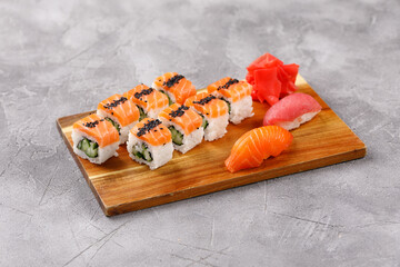 Philadelphia roll with cucumber and sushi with salmon and tuna. Sushi menu. Japanese food. Close-up.