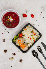 Lunch boxes: dishes in disposable plastic dishes, Russian cuisine - borsch, soup, rice, vegetables, pasta, meat cutlets, mushrooms. Top view