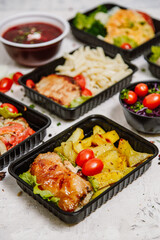Lunch boxes: dishes in disposable plastic dishes, Russian cuisine - borsch, soup, rice, vegetables, pasta, meat cutlets, mushrooms. Top view