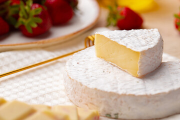 Soft cheese, strawberry and white chocolate close up