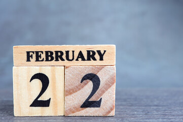 Day 22 of february month, Wooden calendar with date. Empty space for text.