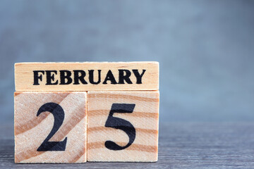 Day 25 of february month, Wooden calendar with date. Empty space for text.