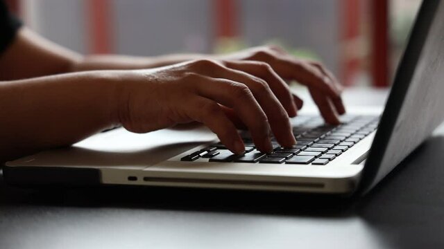 Female hands of business woman professional user worker using typing on laptop notebook keyboard sit at home office desk working online with pc software apps technology concept, close up side view