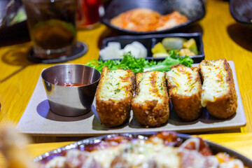 Baked mozzarella chicken rolls. Crispy crust, inside is rolled fresh tender chicken and mozzarella cheese. Serve with sweet and sour sauce