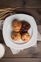 Cookies on a white plate and wheat ear bird's eye view