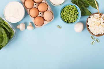 Obraz na płótnie Canvas set of foods with vitamin D on a blue background.