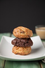 Cookies on a white plate with coffee latte