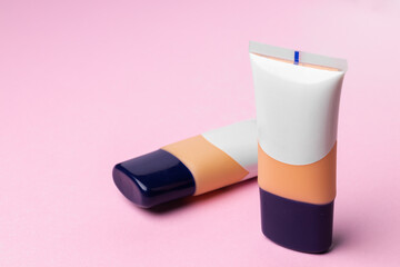 Cosmetics for face complexion on pink background