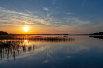 magical sunset over a lake in summer in Europe