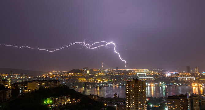 Lightning storm over night city.