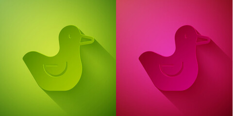 Paper cut Rubber duck icon isolated on green and pink background. Paper art style. Vector.