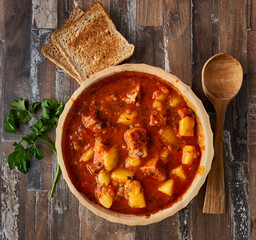 Potato stew with pork with toast
