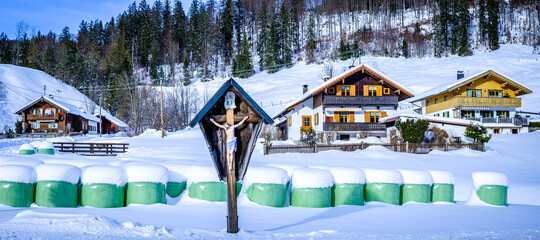 typical bavarian farmhouse near the alps