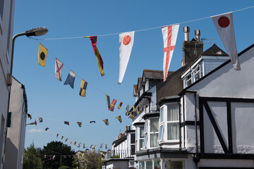 Regatta flags flying from the rooftops in Shaldon, Devon for the historic regatta week in the summer.