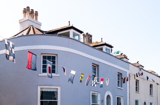 Regatta Flags Flying From The Rooftops In Shaldon, Devon For The Historic Regatta Week In The Summer.