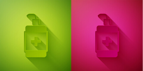 Fototapeta premium Paper cut Hand sanitizer bottle icon isolated on green and pink background. Disinfection concept. Washing gel. Alcohol bottle for hygiene. Paper art style. Vector.