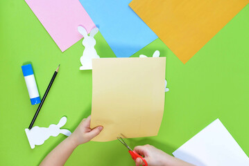DIY and kids creativity. Step by step instruction: Create an Easter card with bunnies. Childrens...