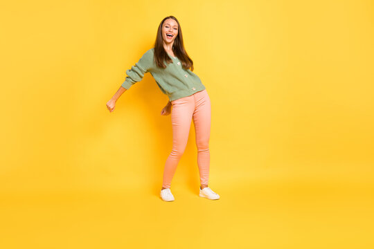 Photo Portrait Full Body View Of Girl Doing Modern Dance Flossing Isolated On Vivid Yellow Colored Background