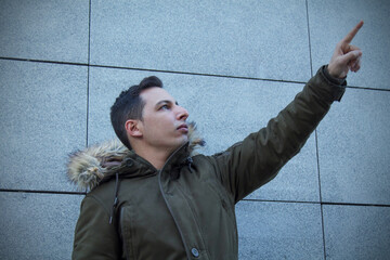 man in parka or anorak pointing fingers © tetxu