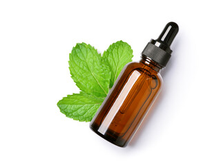 Top view of mint essential oil in amber dropper bottle with fresh mint leaf isolated on white background.