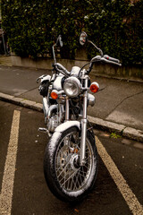 Chopper motorcycle parked with some snow