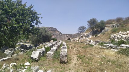 Fototapeta na wymiar Ruins of Letoon ancient city at location Kumluova, Seydikemer, Mugla, Turkey. Letoon added as a UNESCO World Heritage Site along with Xanthos in 1988.