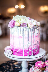 wedding cake with flowers, festive pink cake, candibar, birthday sweets, sweet table at the party
