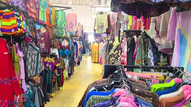 Shop Lot Compact With Various Vibrant And Colorful Traditional Malaysian Clothing - Wide